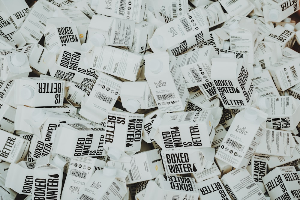White and black printer paper lot photo – Free Boxed water Image on Unsplash