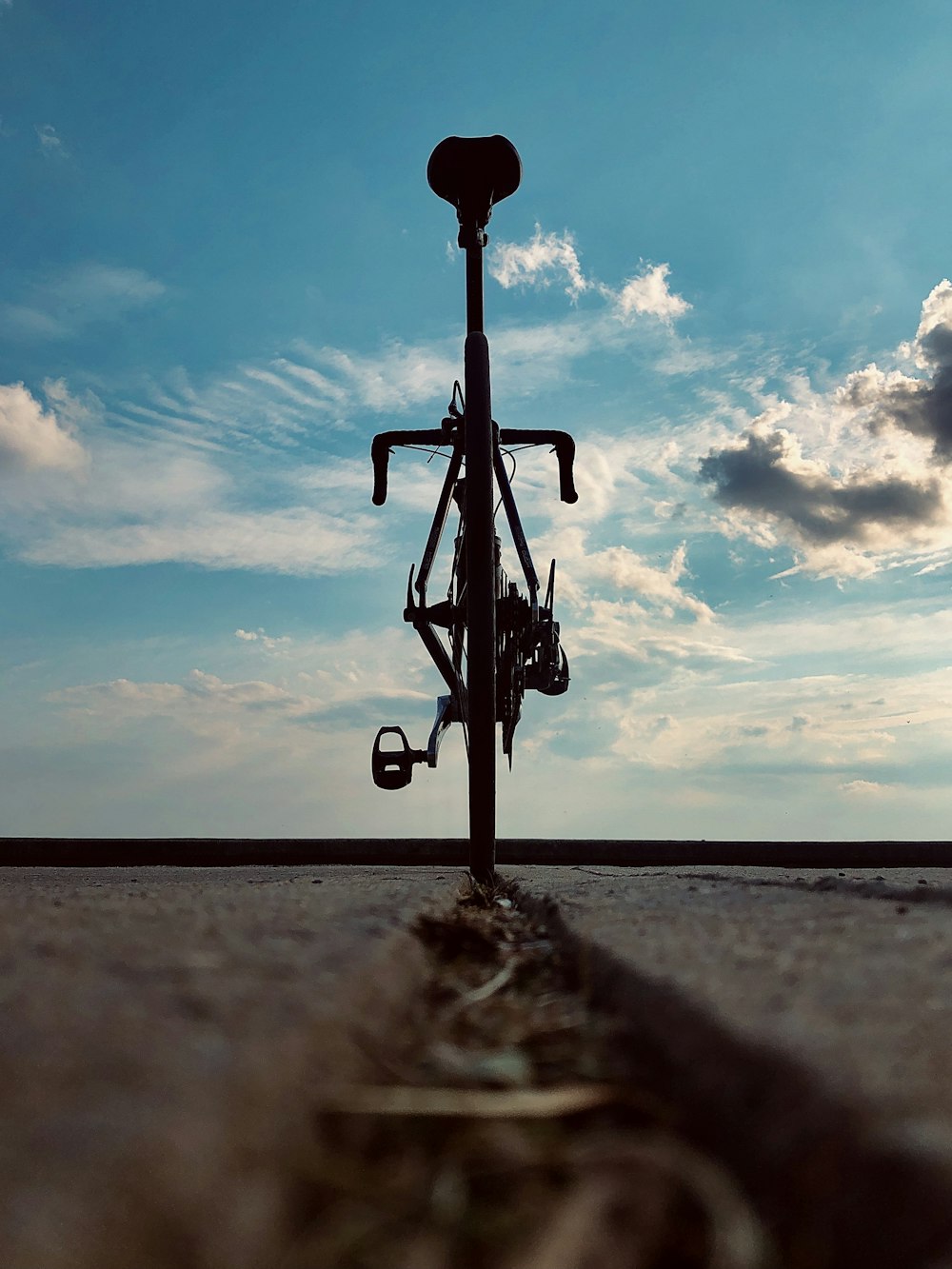 black bicycle on gray sand during daytime