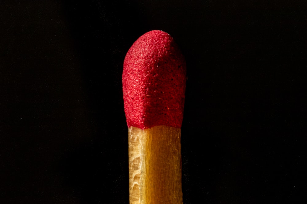 red and brown wooden stick