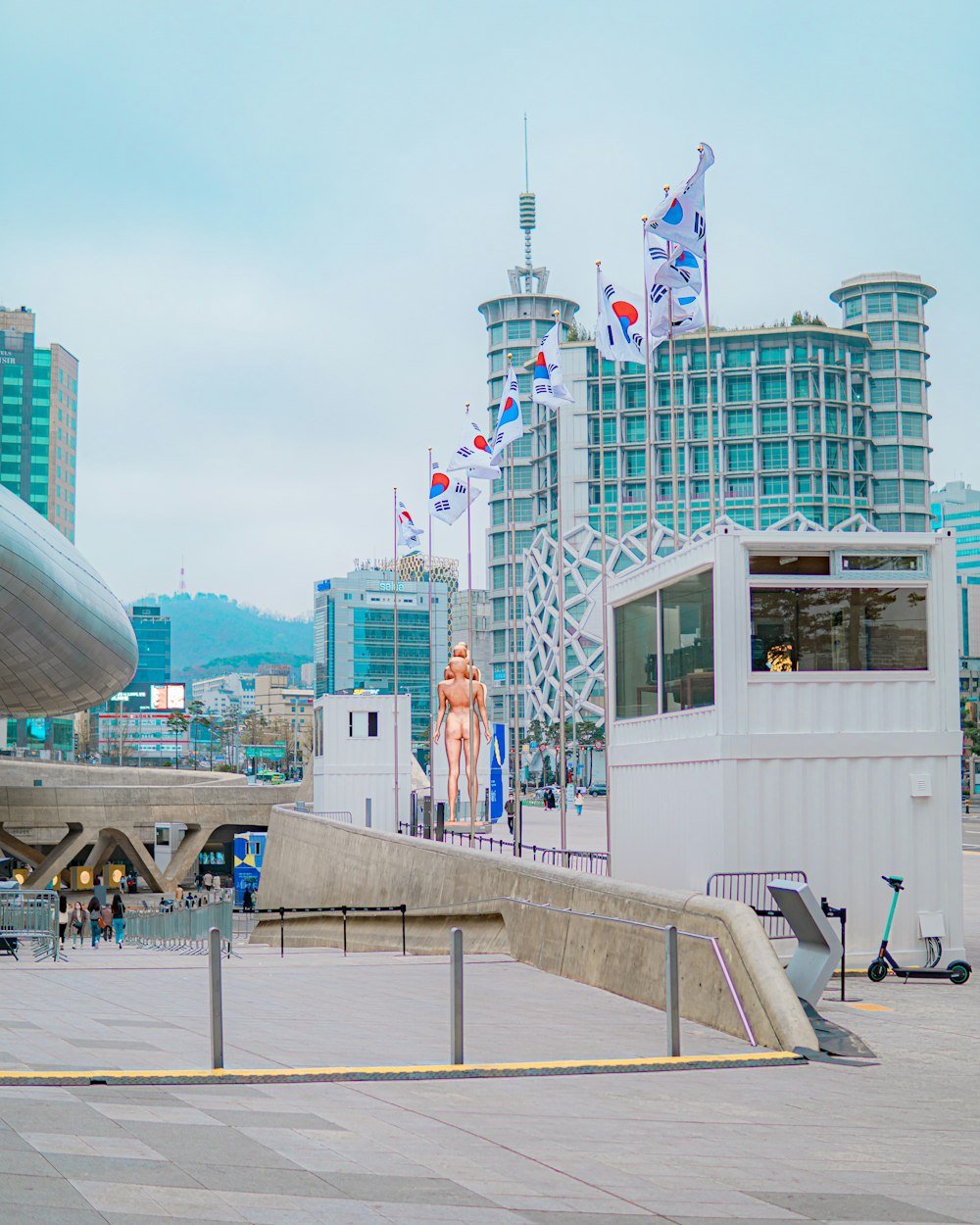 people walking on the street near white concrete building during daytime