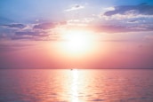 body of water under blue sky during daytime