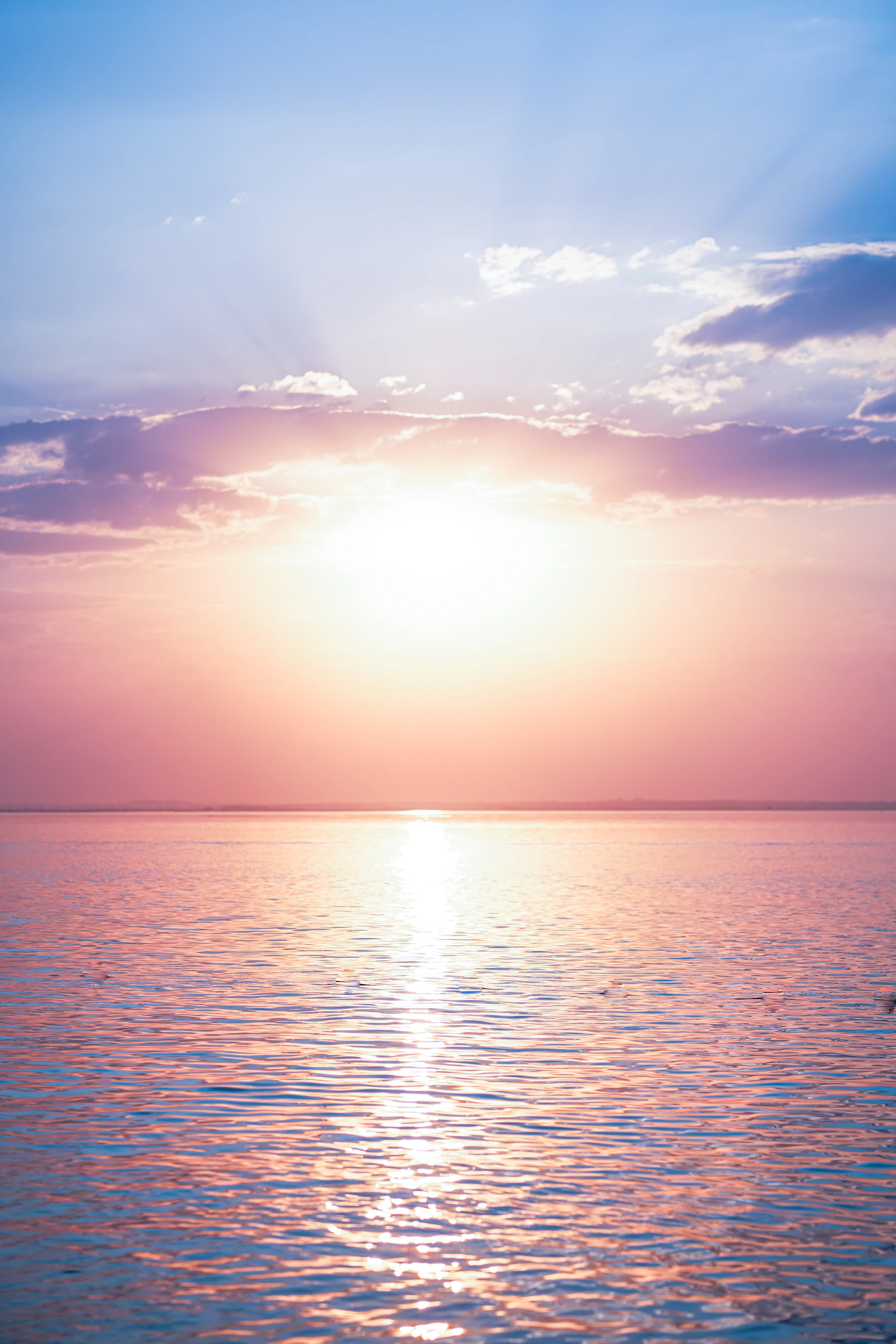 body of water under blue sky during daytime