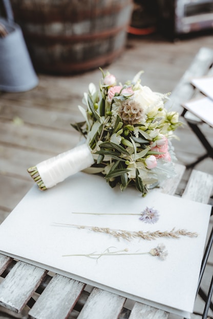 white flower bouquet on white paper
