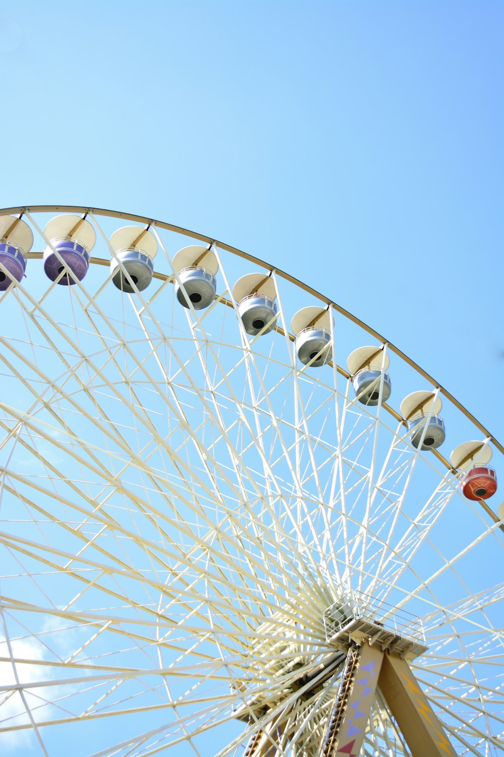 white ferris wheel under blue sky during daytime