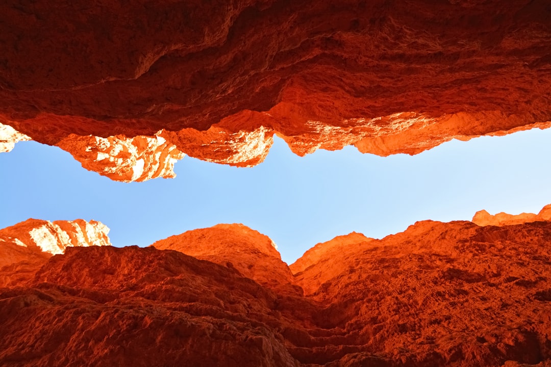 brown rocky mountain under blue sky during daytime