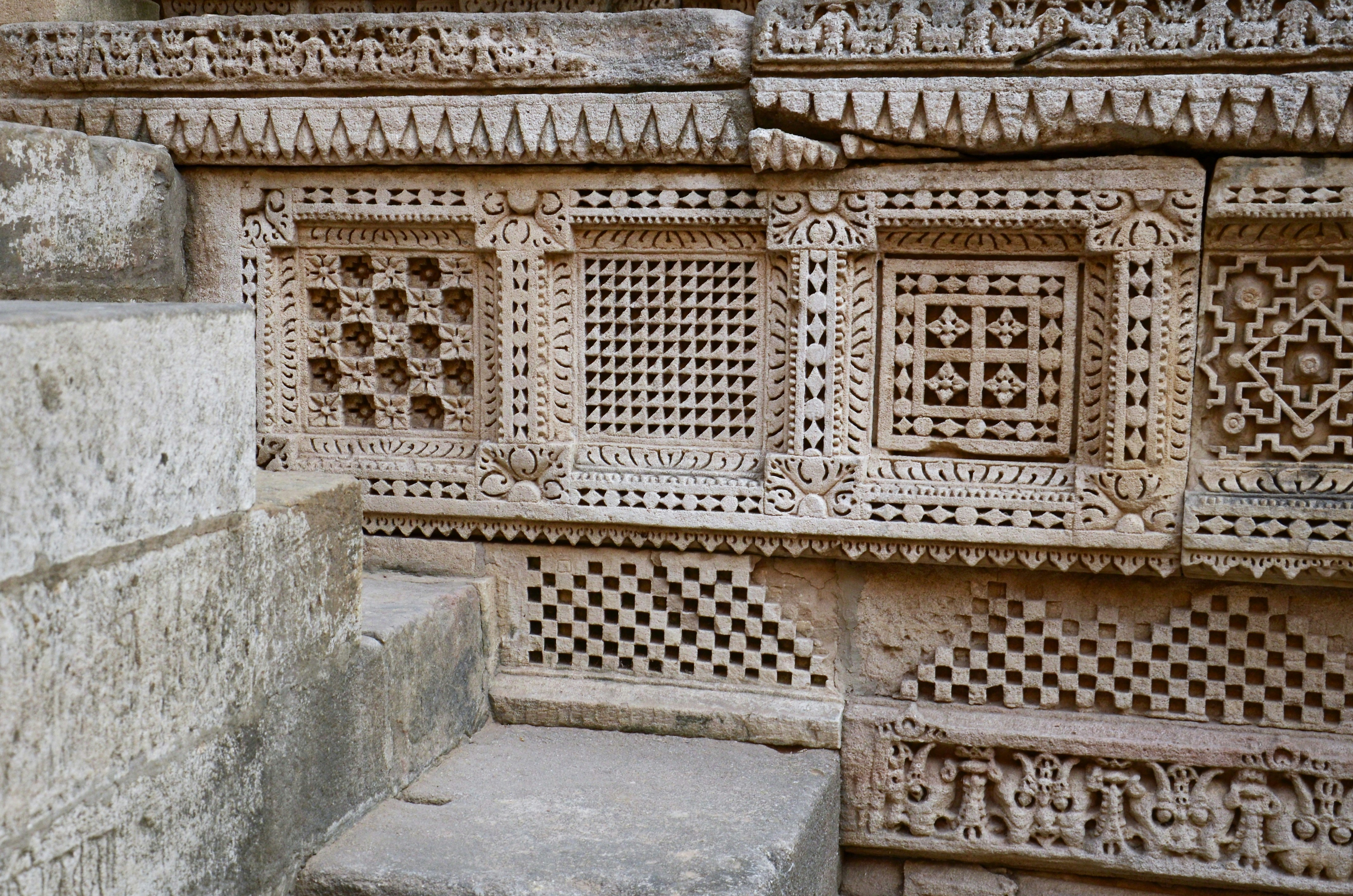 Geometric carved patterns on temple furniture