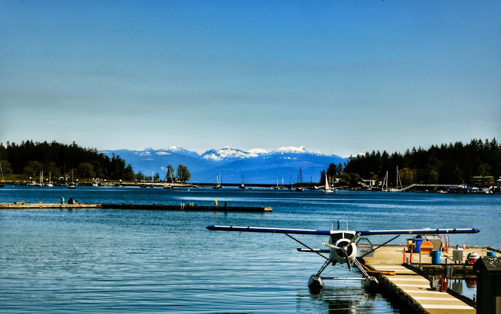 white and black boat on sea during daytime