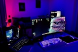 black flat screen computer monitor turned on beside black computer keyboard