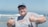 A happy customer giving a thumbs up in a maritime setting.