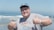 A happy customer giving a thumbs up in a maritime setting.