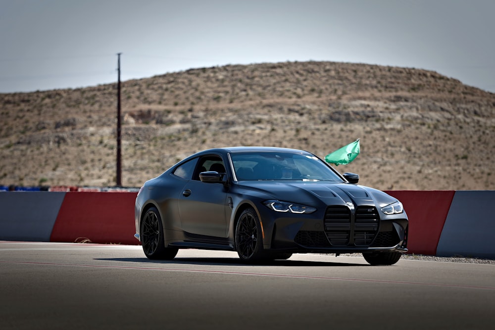 blue bmw m 3 coupe on road during daytime