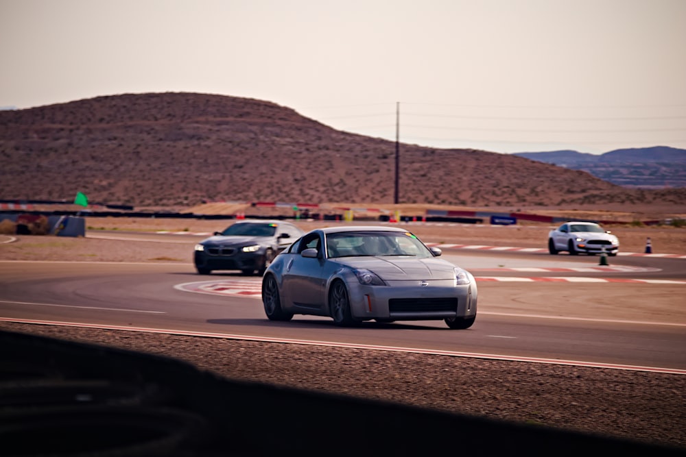 gray sedan on road during daytime