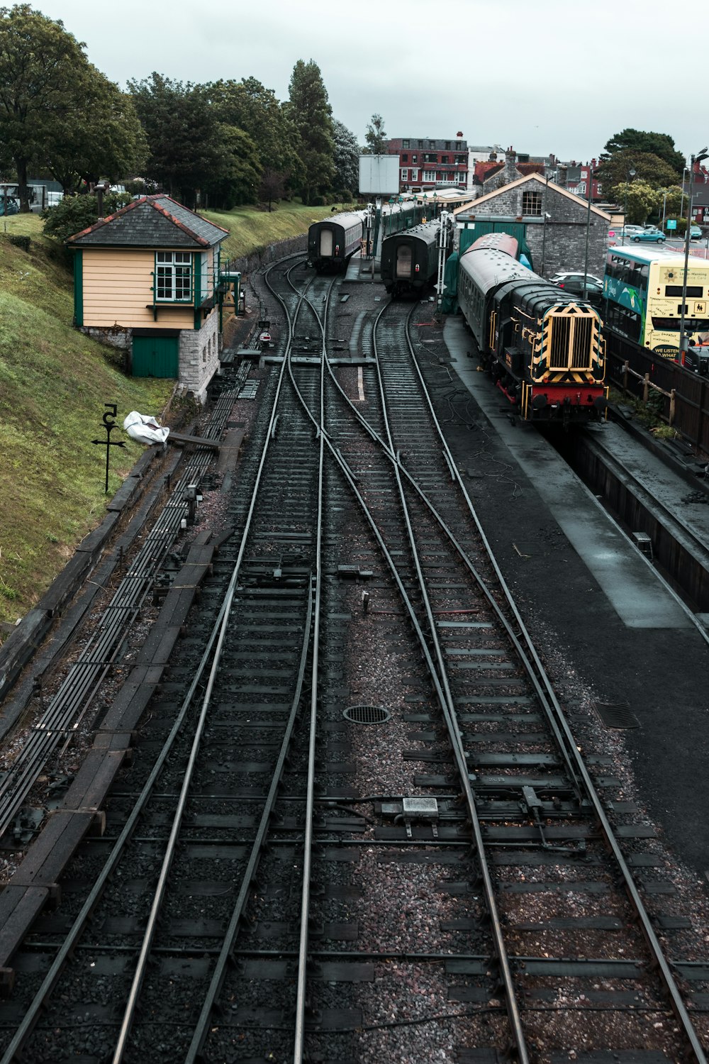 red and black train on rail tracks during daytime