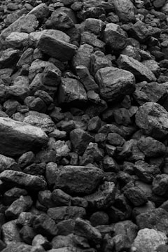 grayscale photo of rocks during daytime