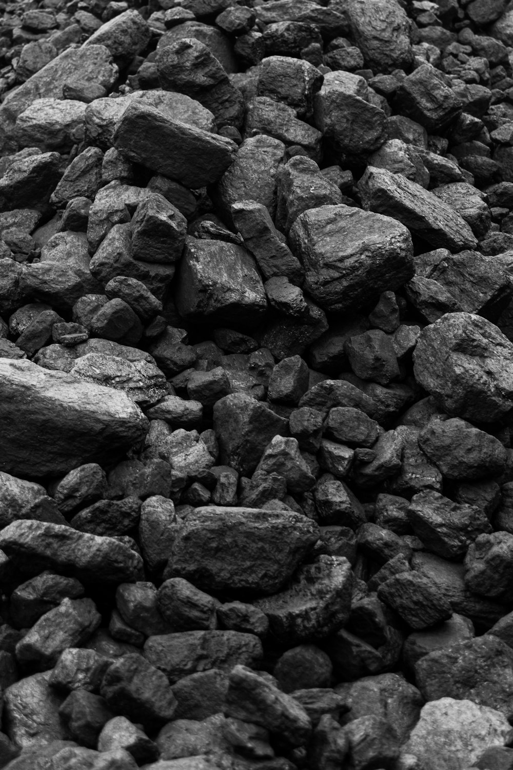 grayscale photo of rocks during daytime