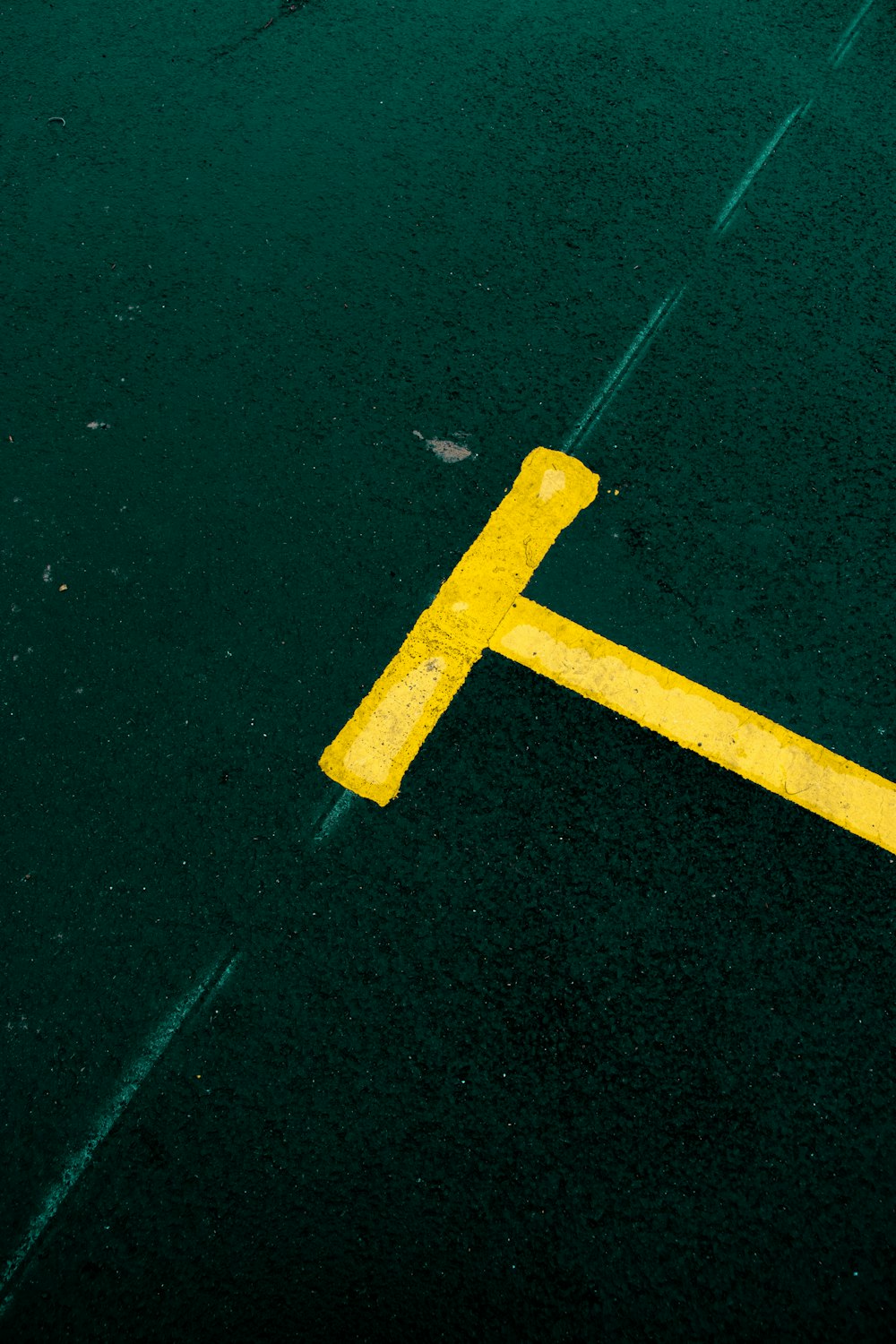 yellow metal tool on green textile