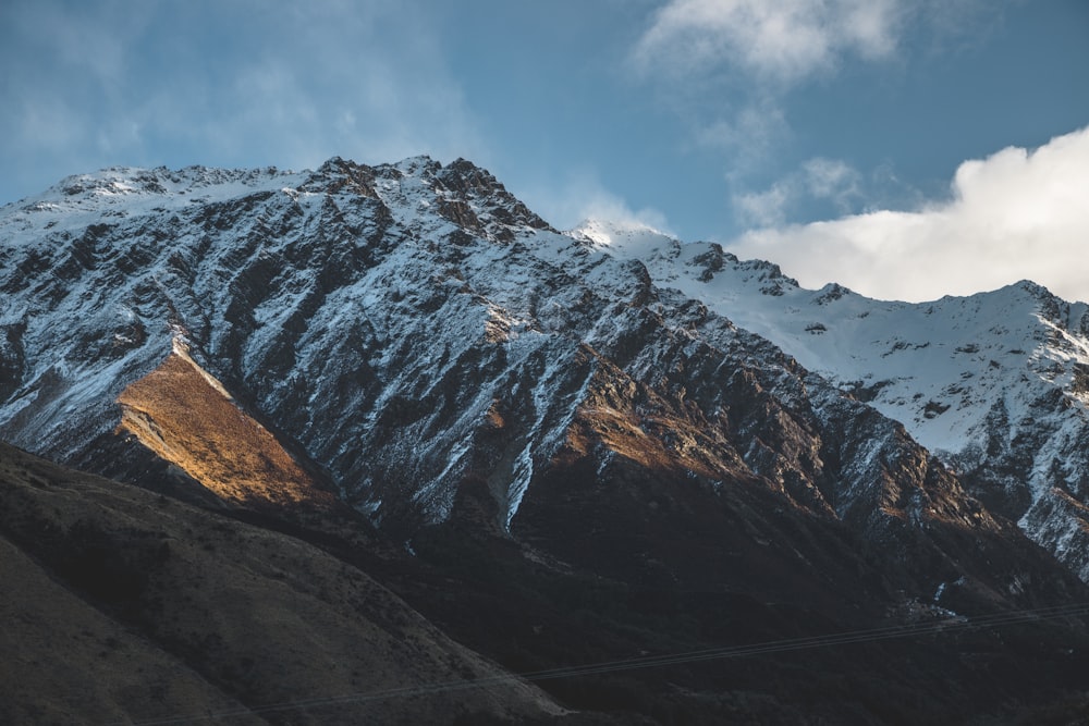 snow covered mountain under blue sky during daytime