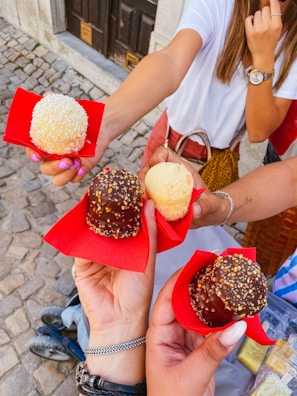 Visitors enjoying a chocolate tasting session outdoors.