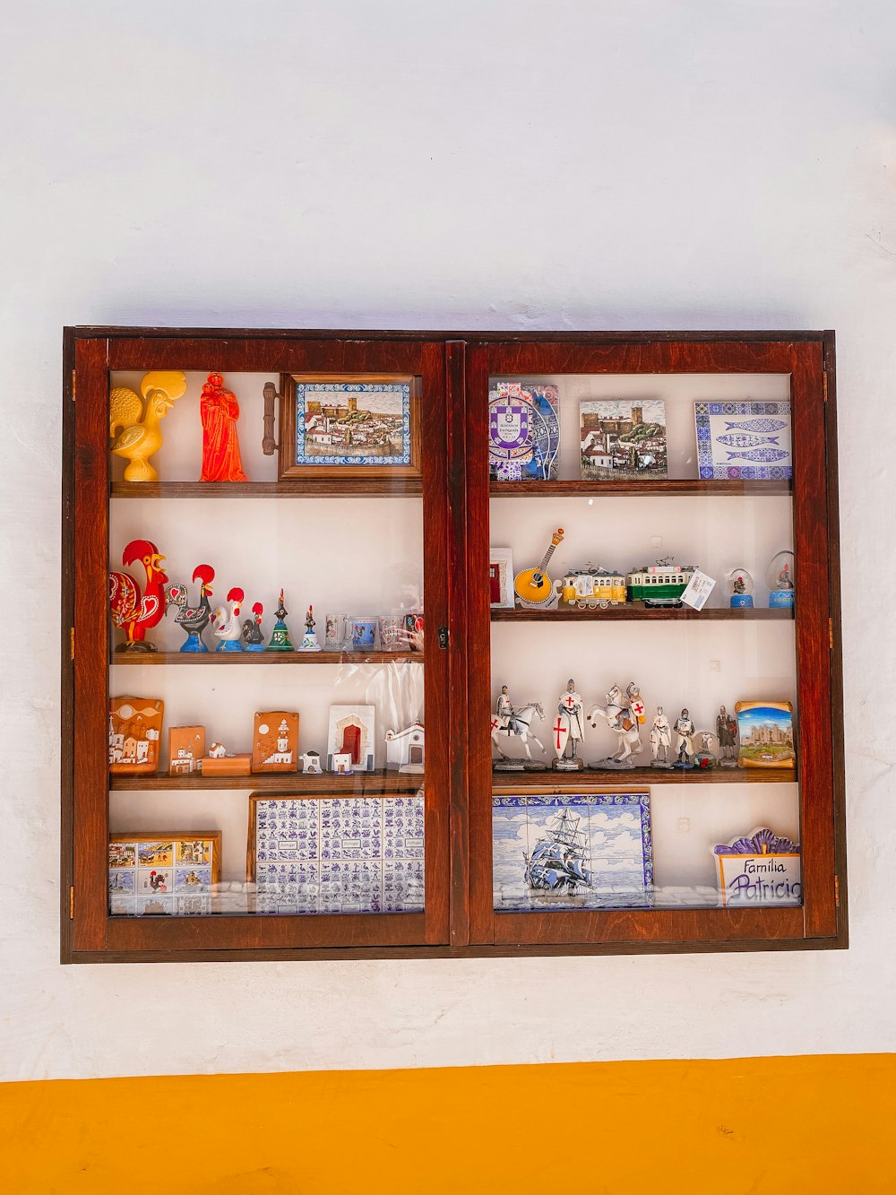 brown wooden framed glass cabinet