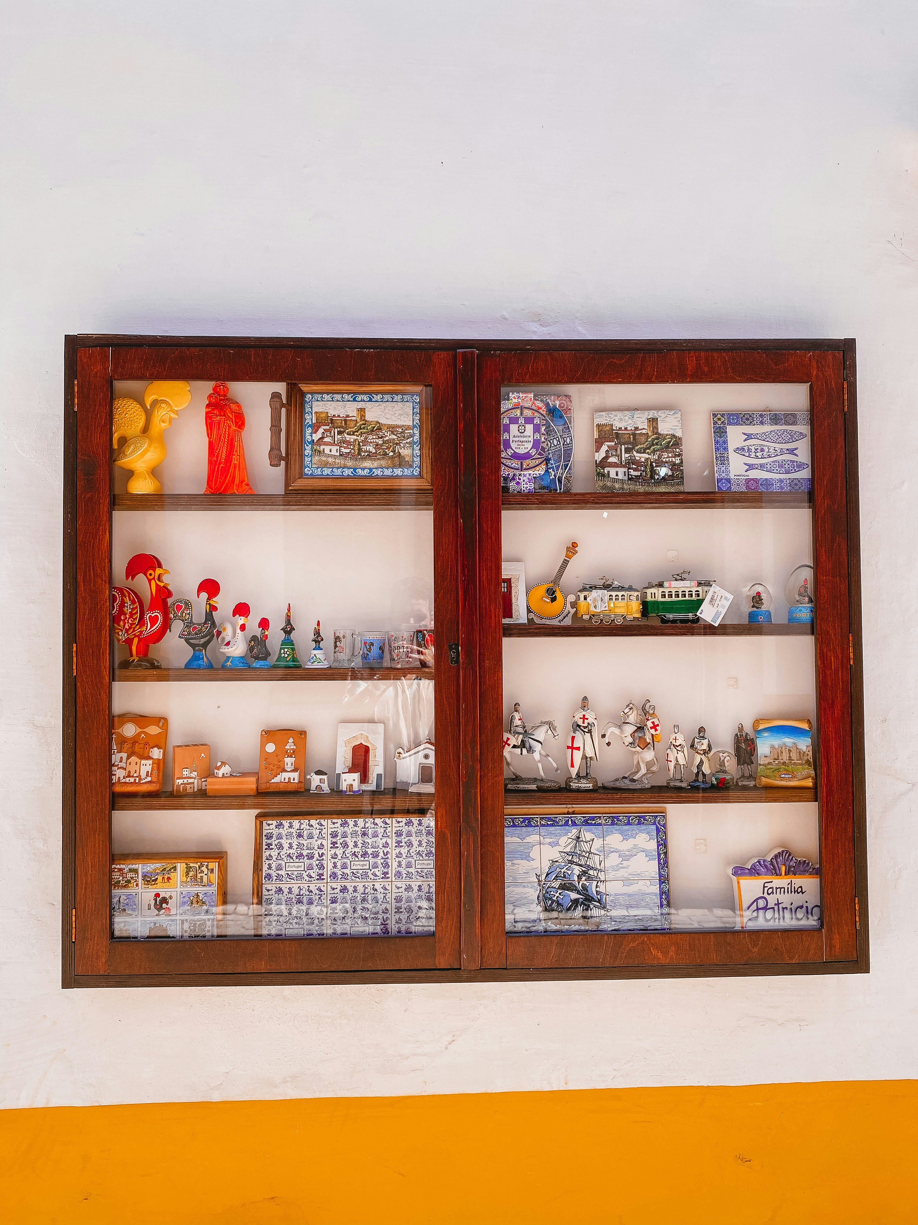 brown wooden framed glass cabinet