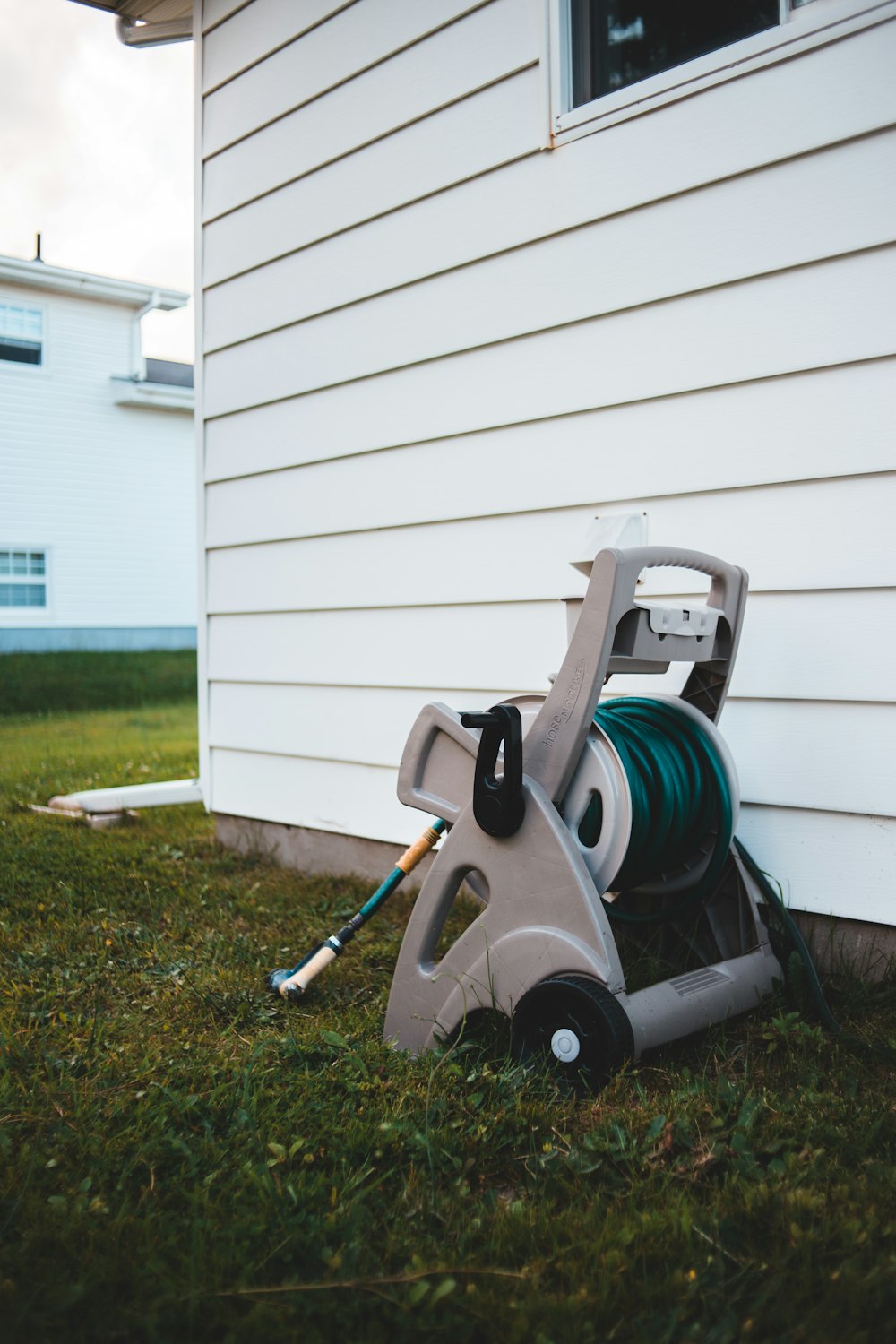 gray and green vacuum cleaner