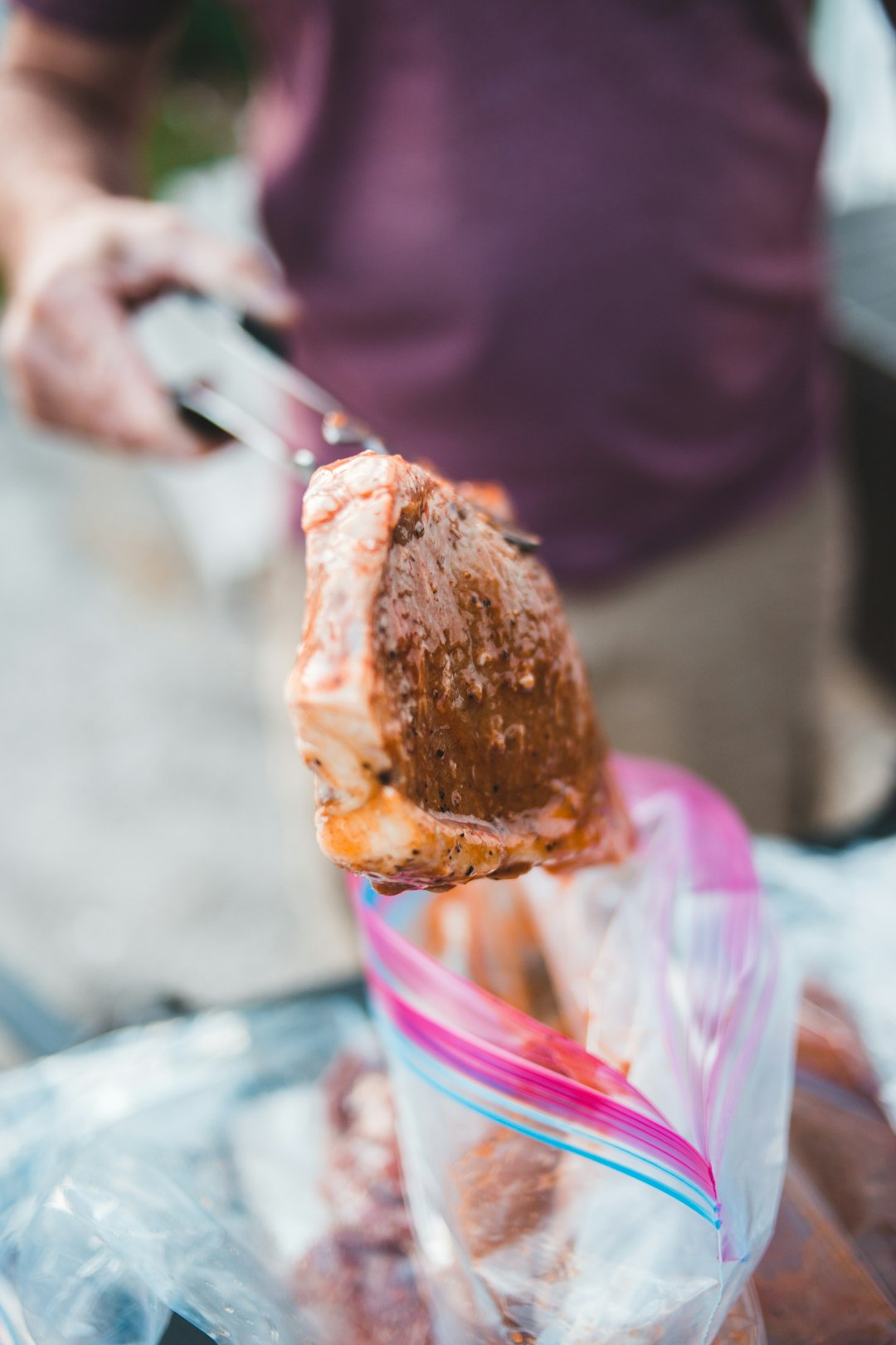 person holding knife slicing cake