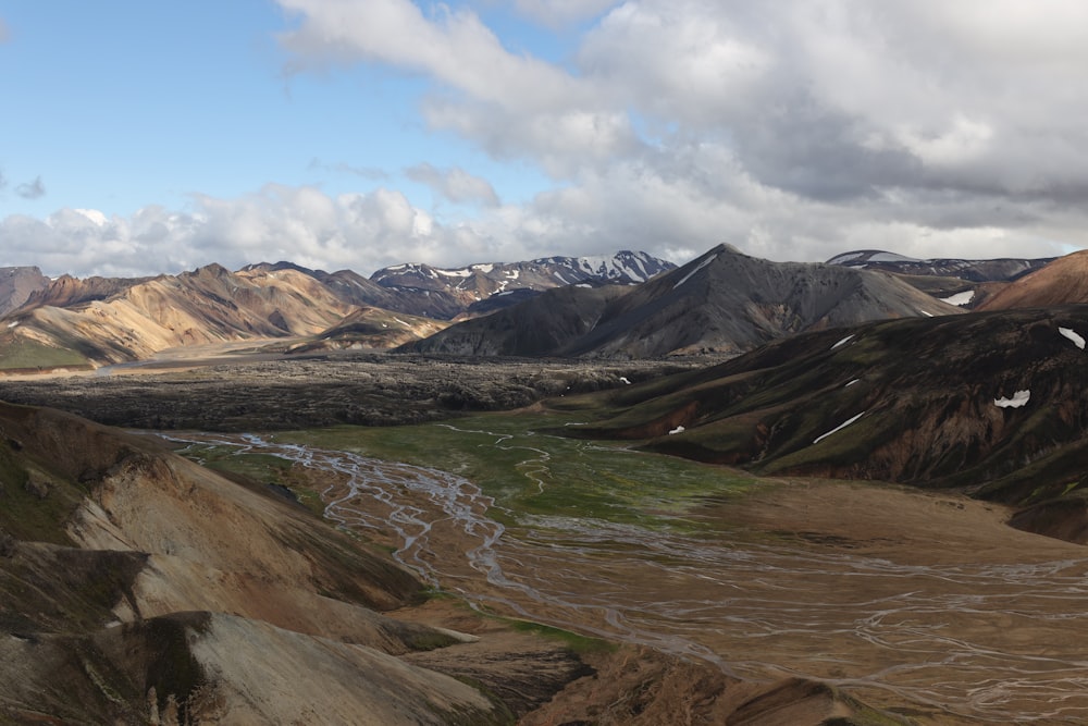 brown and green mountains under blue sky during daytime