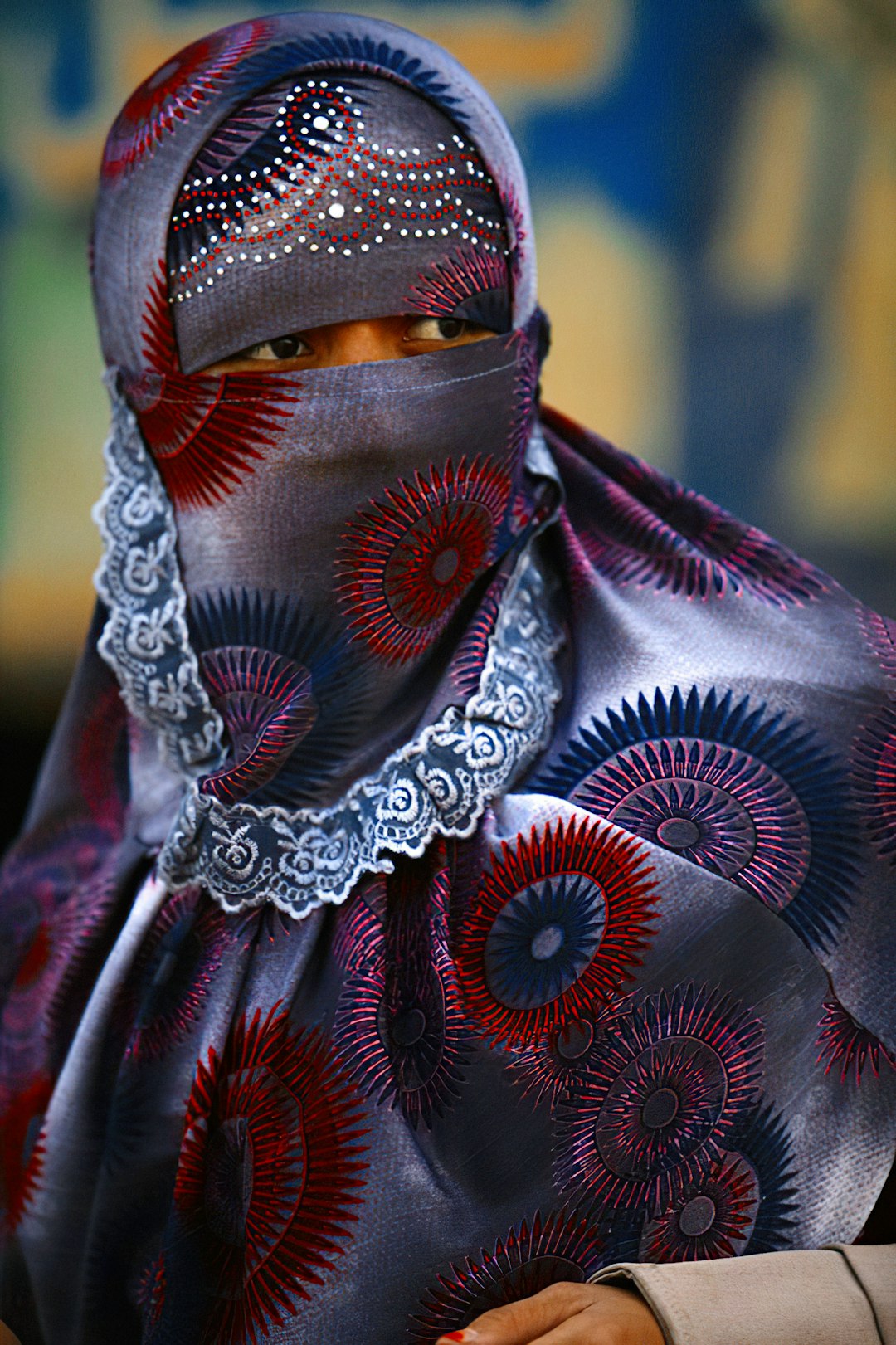 woman in red and white hijab