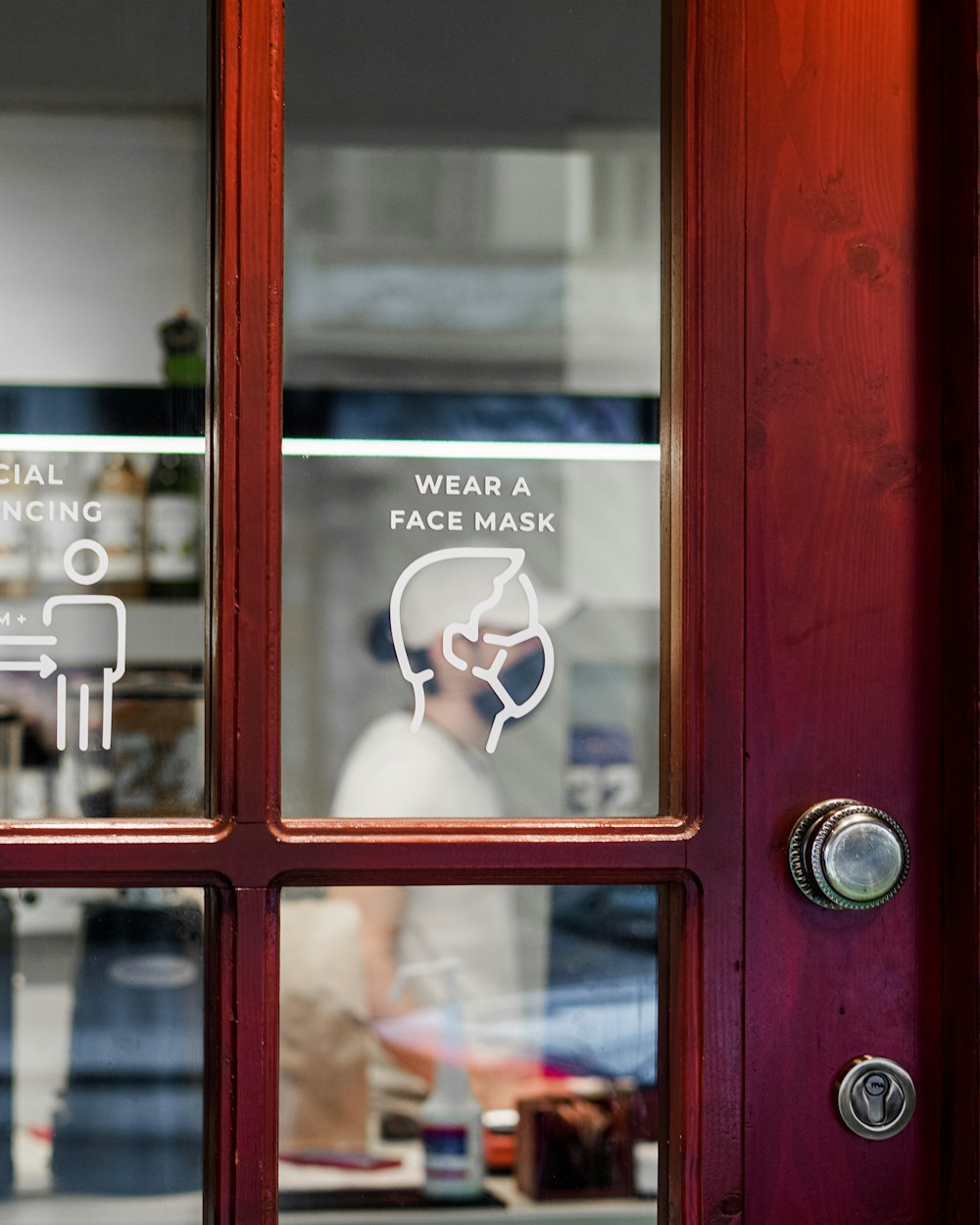 red wooden framed glass door