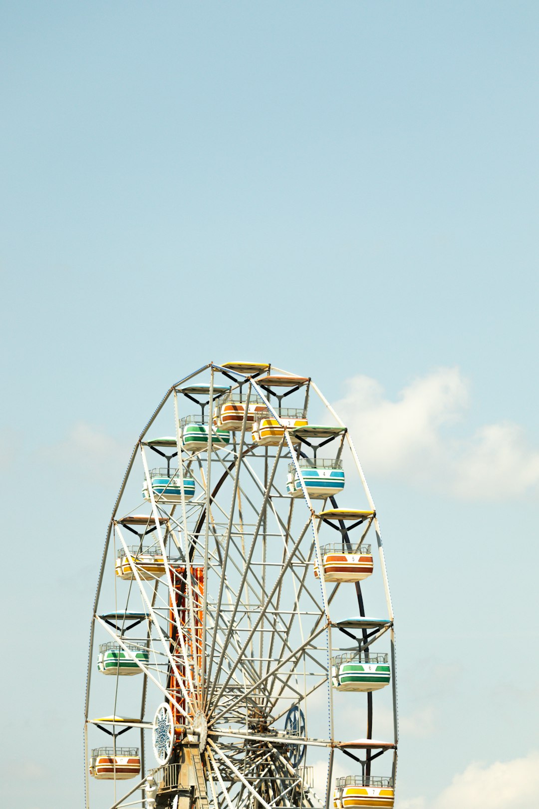 white and red ferris wheel under blue sky during daytime