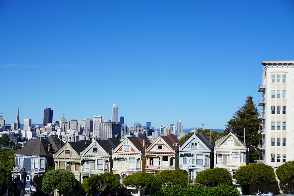 white and black houses under blue sky during daytime