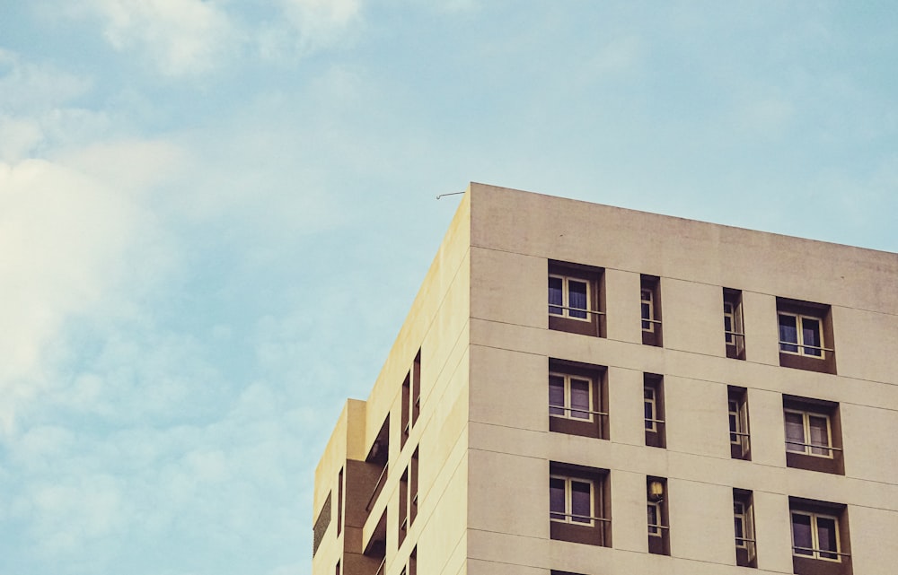 beige concrete building under blue sky during daytime