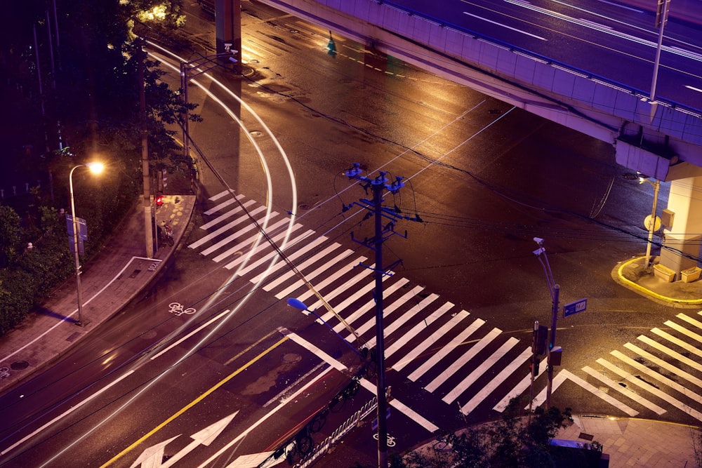 time lapse photography of cars on road during night time