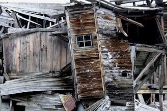 A half-built wooden contraption leaning precariously against a cluttered corner.