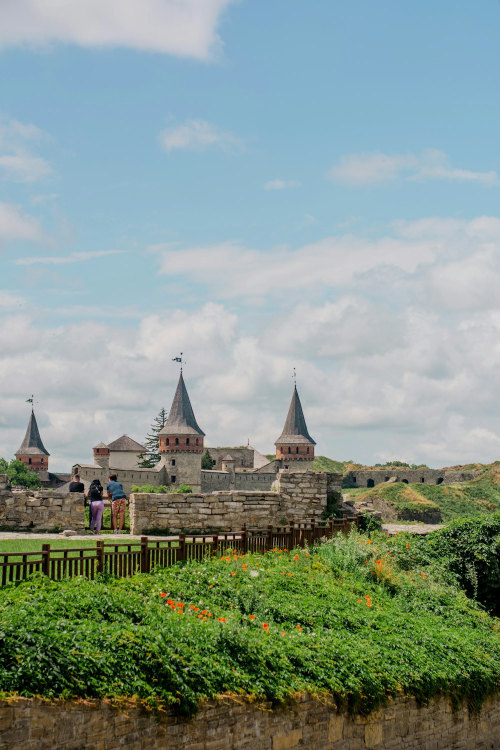 green and brown castle under white clouds during daytime