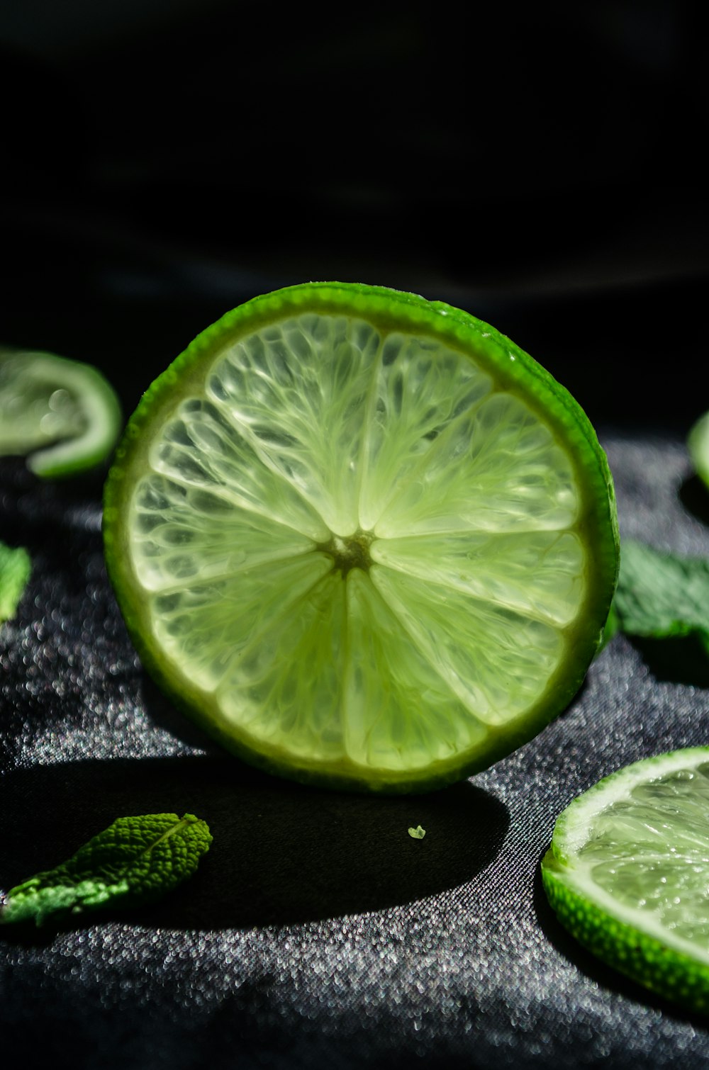 sliced lemon on black surface