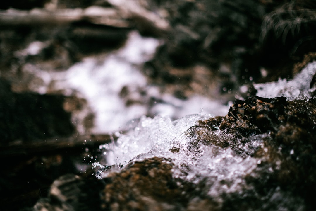 water splash on brown rock