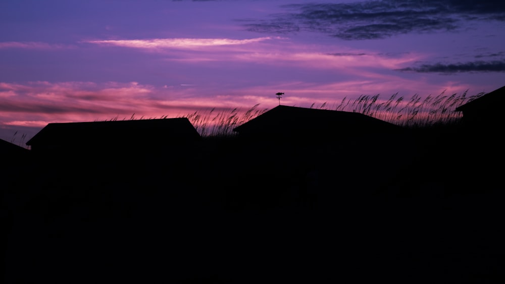 silhouette of house during sunset