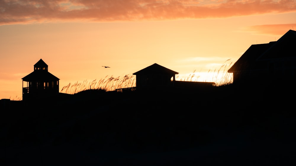 silhouette of house during sunset