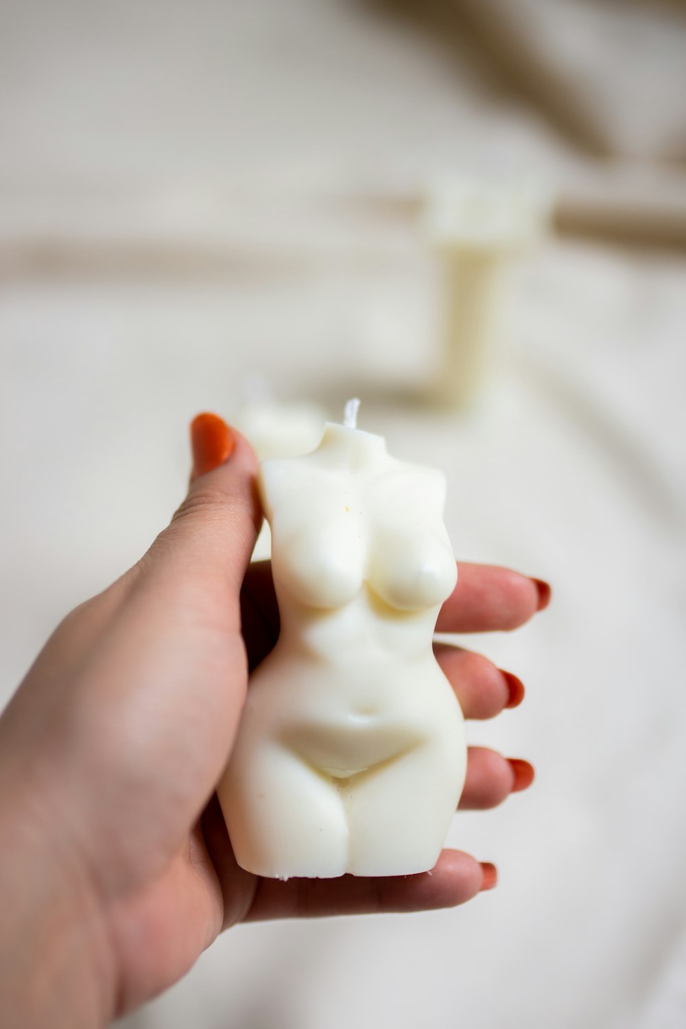white ceramic figurine with white cream