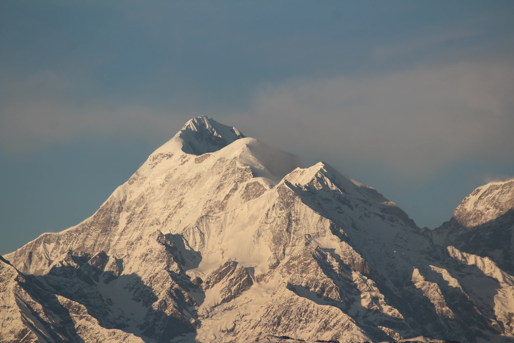 Snow covered Himalayan peaks under a clear blue sky