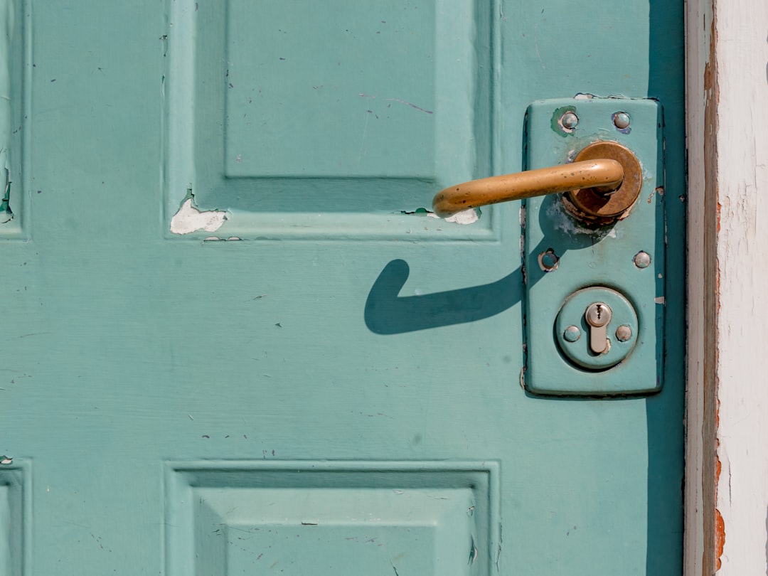  white wooden door with brass door lever door frame