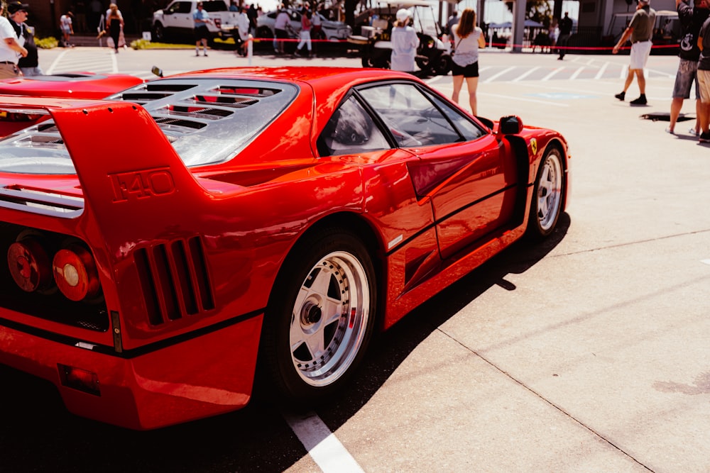 red ferrari 458 italia parked on parking lot