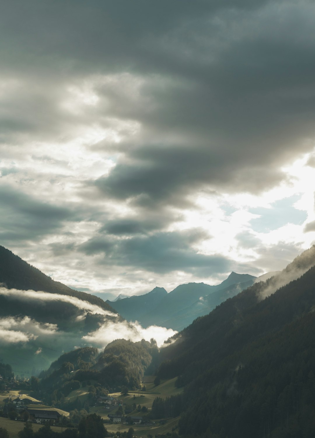 green mountains under white clouds during daytime