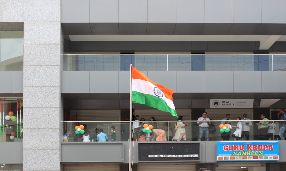 people in a building with flags