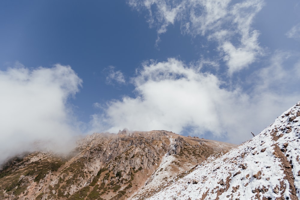 brown and white mountain under blue sky during daytime