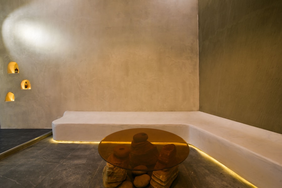 Softly lit sitting area with warm plaster walls and a low wooden table