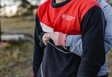 man in black and red long sleeve shirt