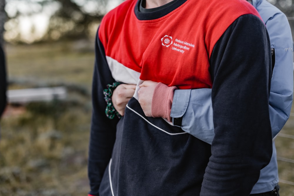 man in black and red long sleeve shirt