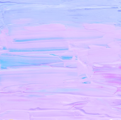 A pastel abstract painting featuring smooth, sweeping brushstrokes primarily in shades of lavender, pink, and hints of blue. The texture is soft and the colors blend seamlessly across the canvas, creating a calming and soothing visual effect.